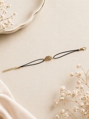 Delicate Black Cord Bracelet with Gold Leaf Accent